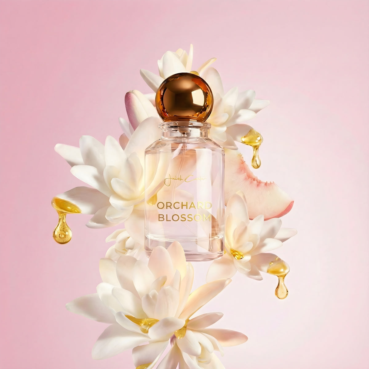 Orchard Blossom perfume bottle with a gold spherical cap among white blossoms and golden droplets against a pink background.